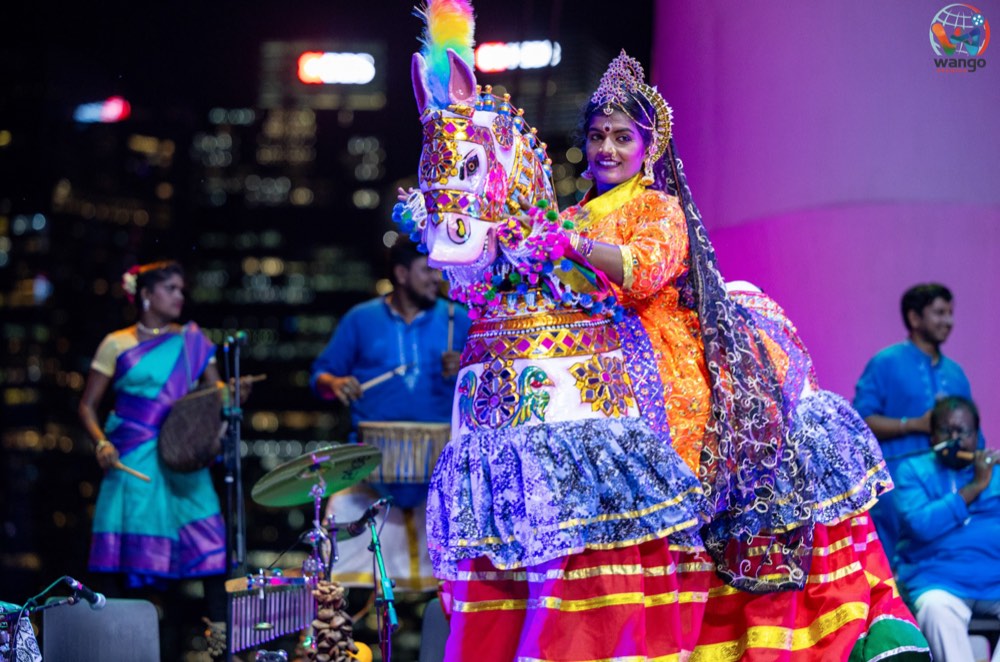 A Poikkaal Kuthirai Aattam performer wearing the horse frame