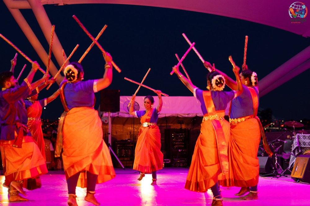 Sakkai Kuchi Aattam performers striking sticks in pairs